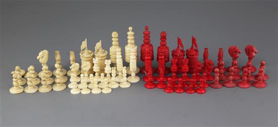 A 19th century Anglo Indian carved and stained bone chess set & another